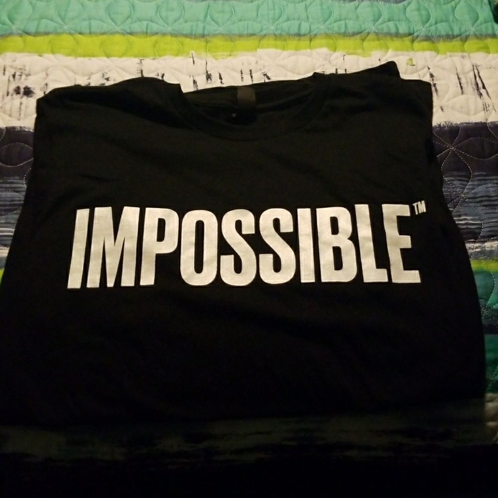 Impossible black t shirt. Brand new.